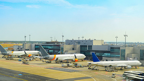 Airplanes at runway by the airport terminal, Frankfurt am Main, Germany